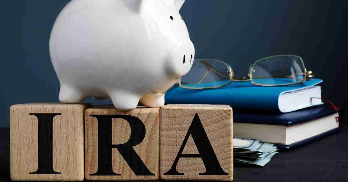 IRA individual retirement account written on wooden cubes.