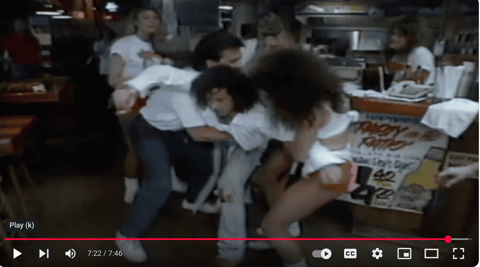 Dispute at a restaurant over a bill, with individuals arguing and pushing each other in a busy dining environment, highlighting conflict resolution in hospitality settings.